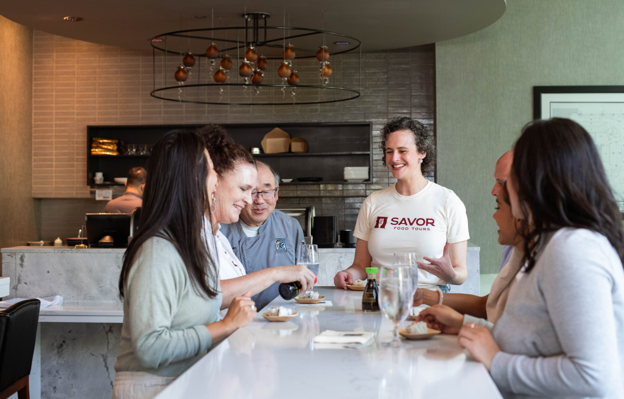 tour guide standing in restaurant leading group
