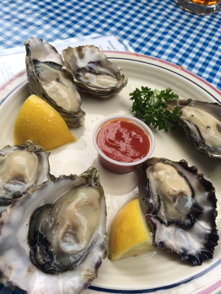 Oysters, lemon, plate, checker tablecloth